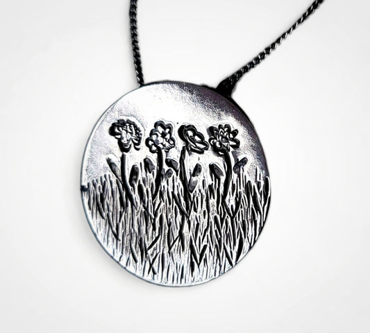 Personalized birth flower necklace in sterling silver.