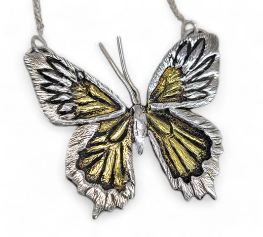 one of a kind butterfly necklace handcrafted by Jaclyn Nicole. Unique Pendant made in Sterling Silver and brass