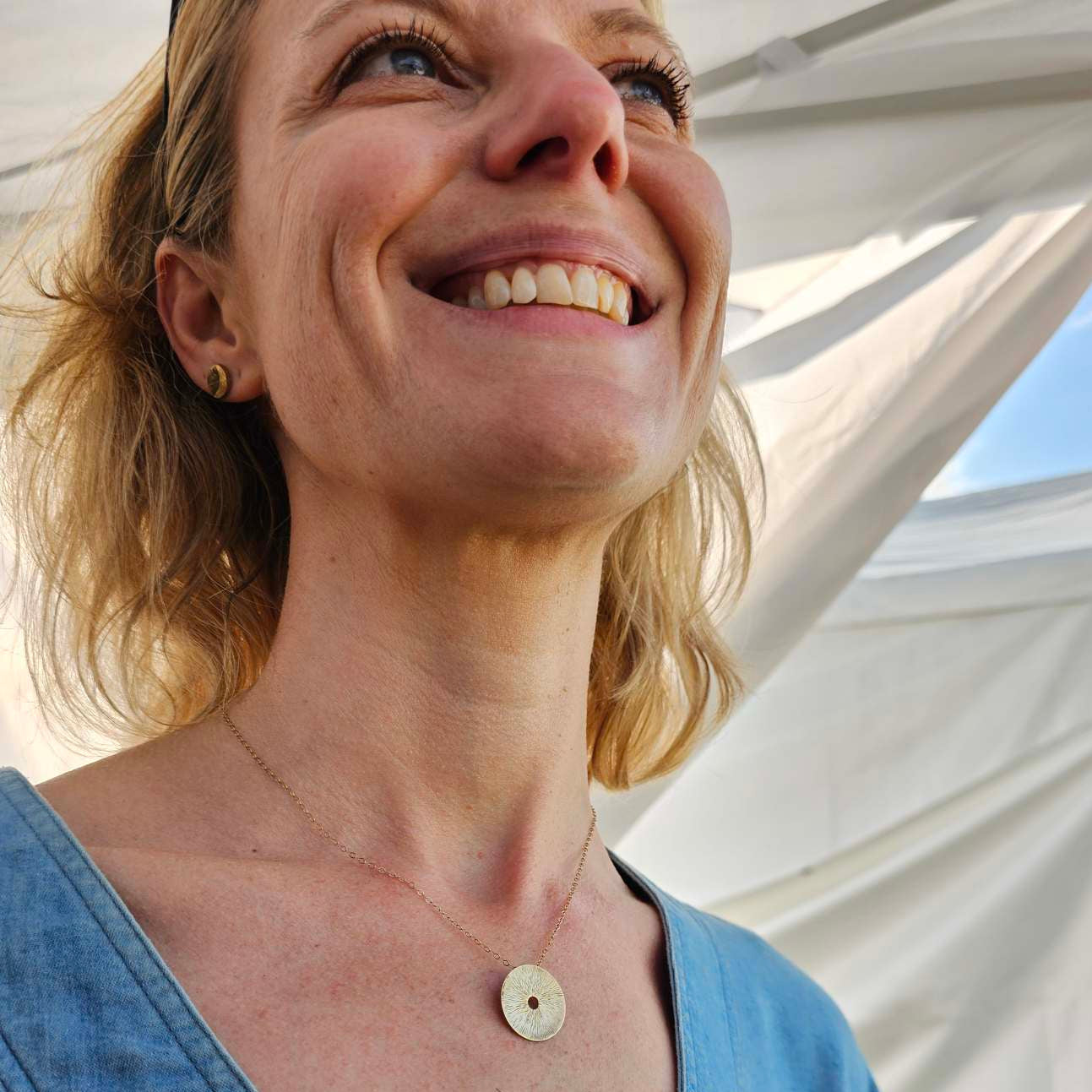 Gold Manifestation Necklace by Jaclyn Nicole on Smiling Woman