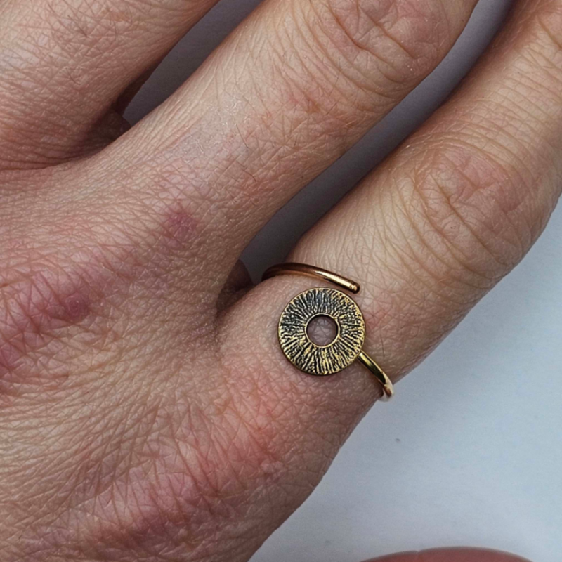 Gold Circle adjustable ring on woman's finger