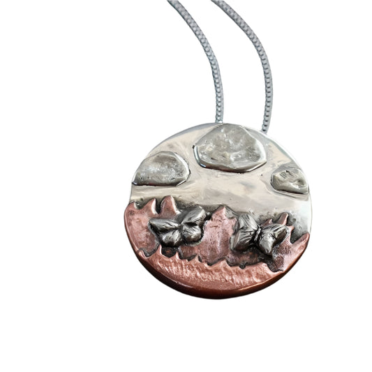 Handmade Silver and Copper necklace of mountains, butterflies and clouds.