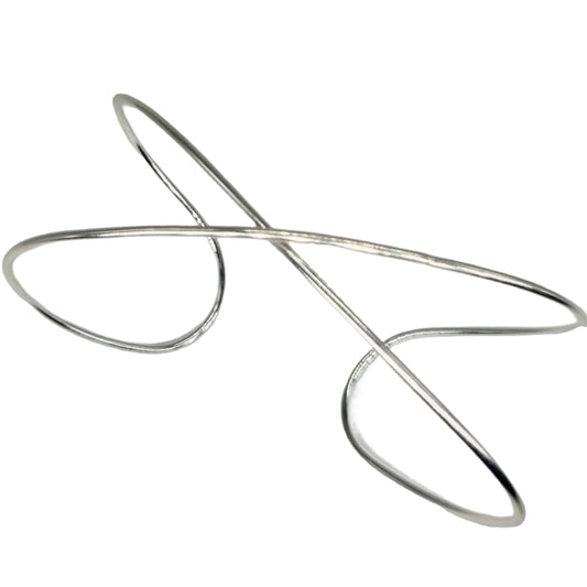 Handmade Sterling Silver Infinity bracelet on a white background.