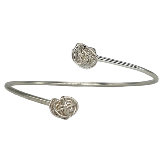 Close up of handmade Winding knot bracelet in sterling silver