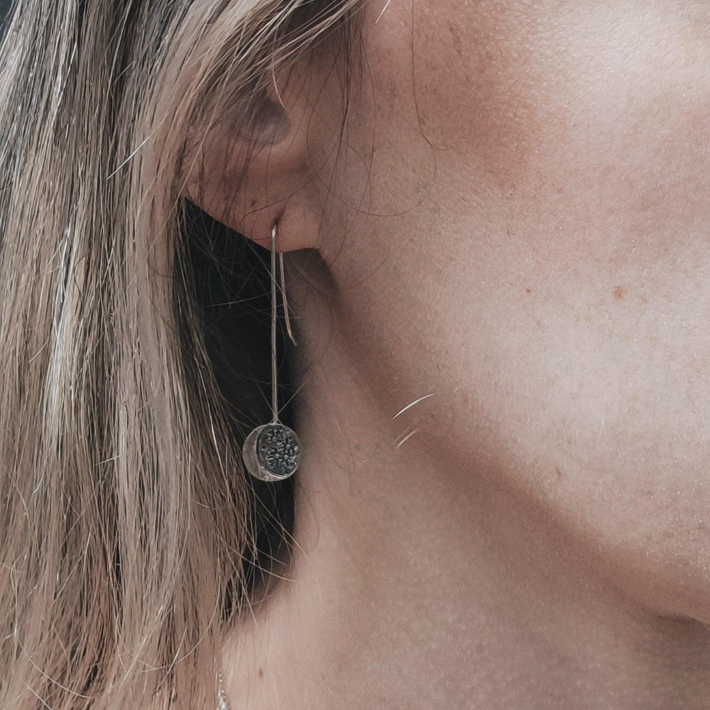 Stars and Moon Earrings in sterling silver modeled on a woman's ear