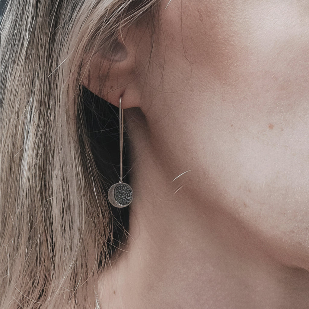 Stars and Moon Earrings in sterling silver modeled on a woman's ear