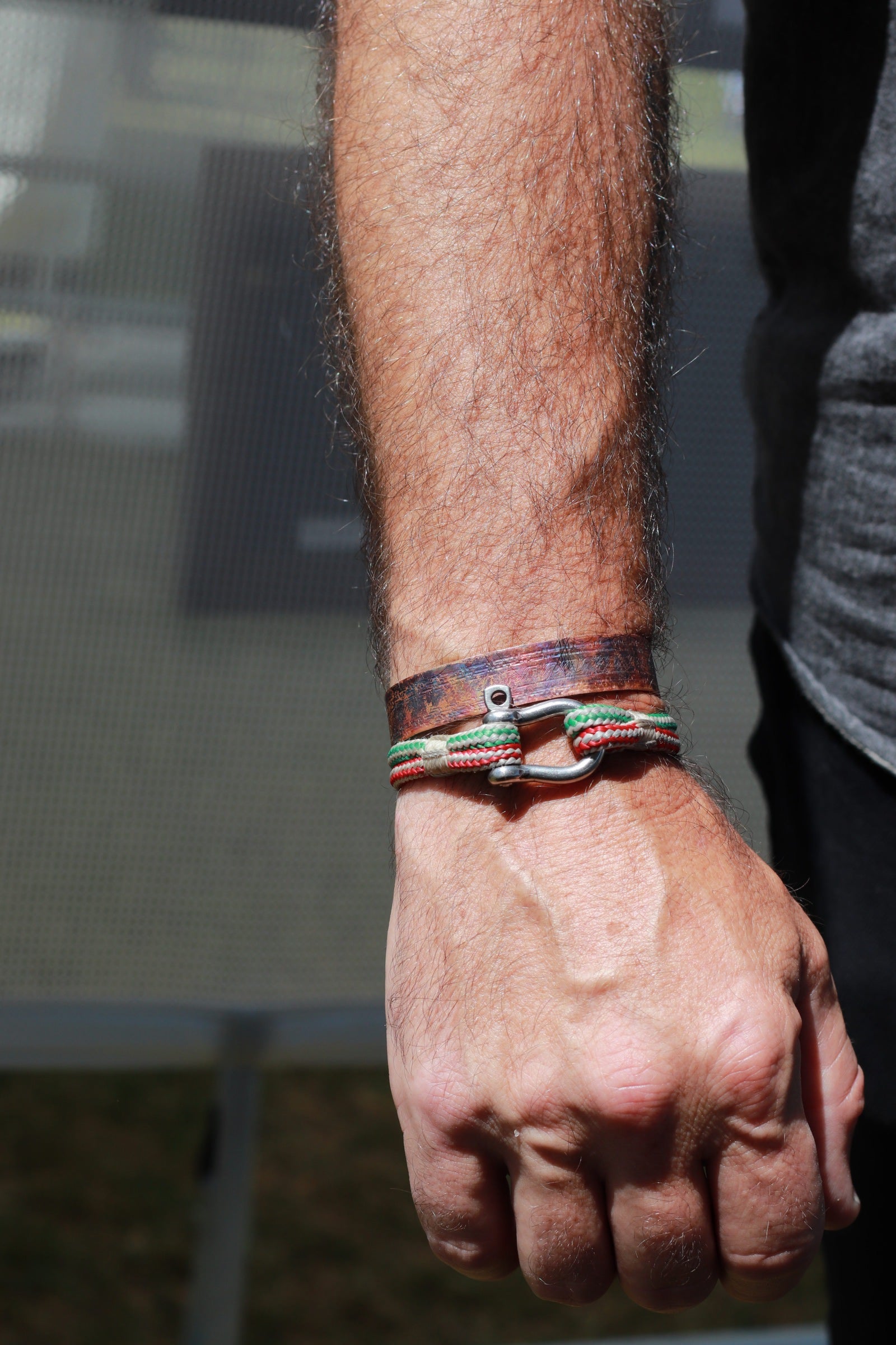 flame painted copper cuff bracelets modeled on man's wrist