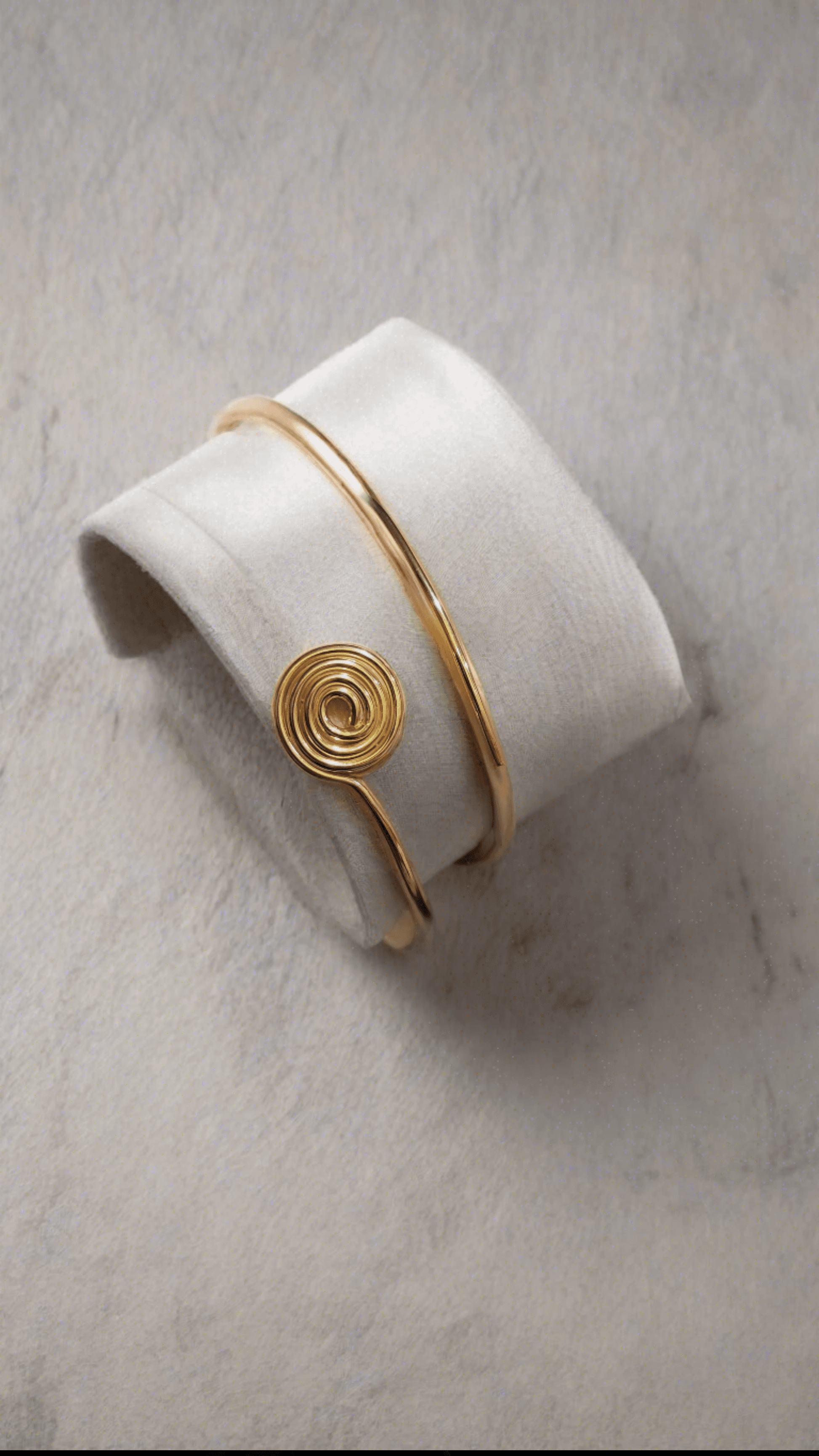 14K Gold Cuff Bracelet with meaning on jewelry display