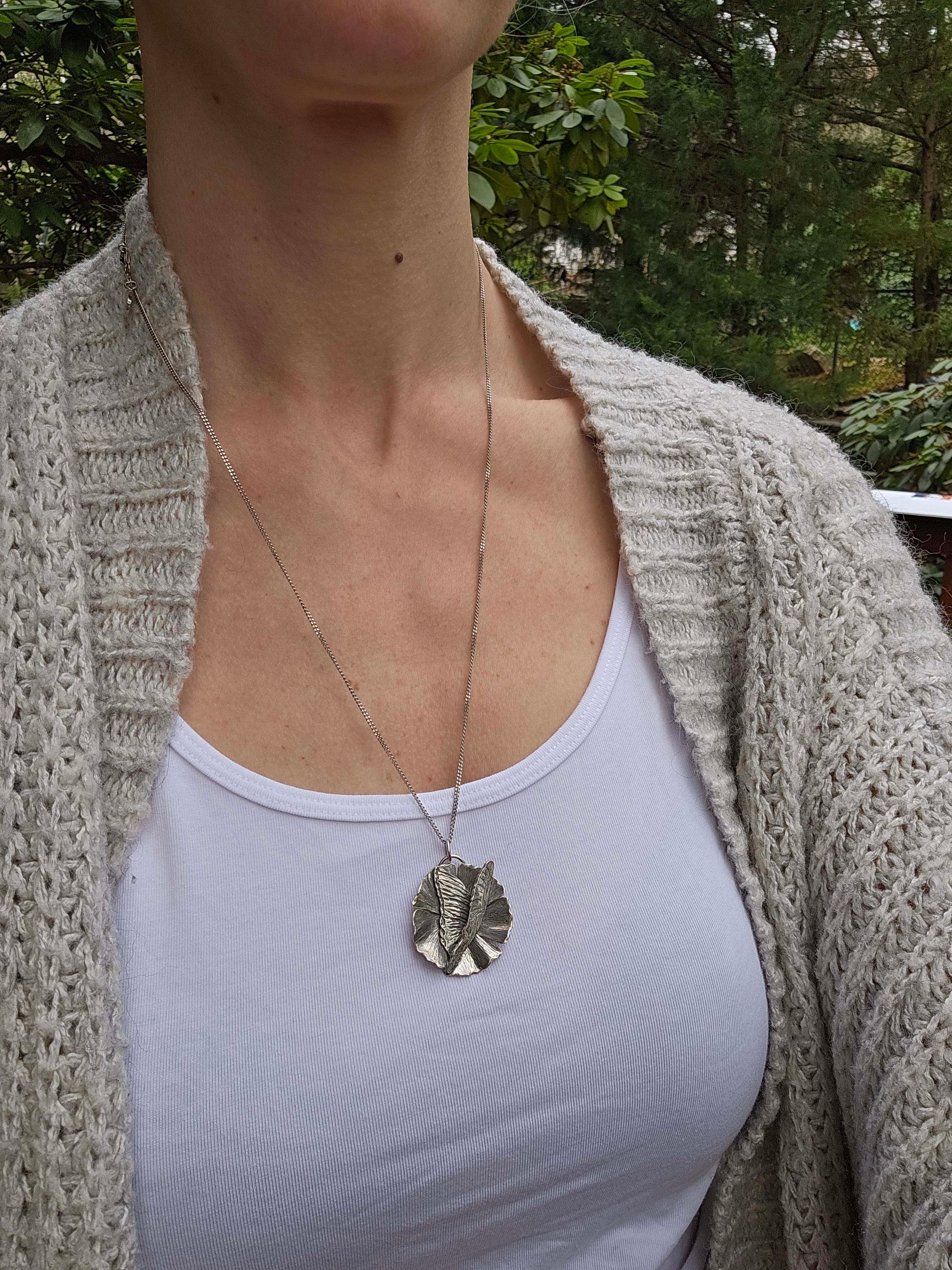Handcrafted silver butterfly necklace with flower