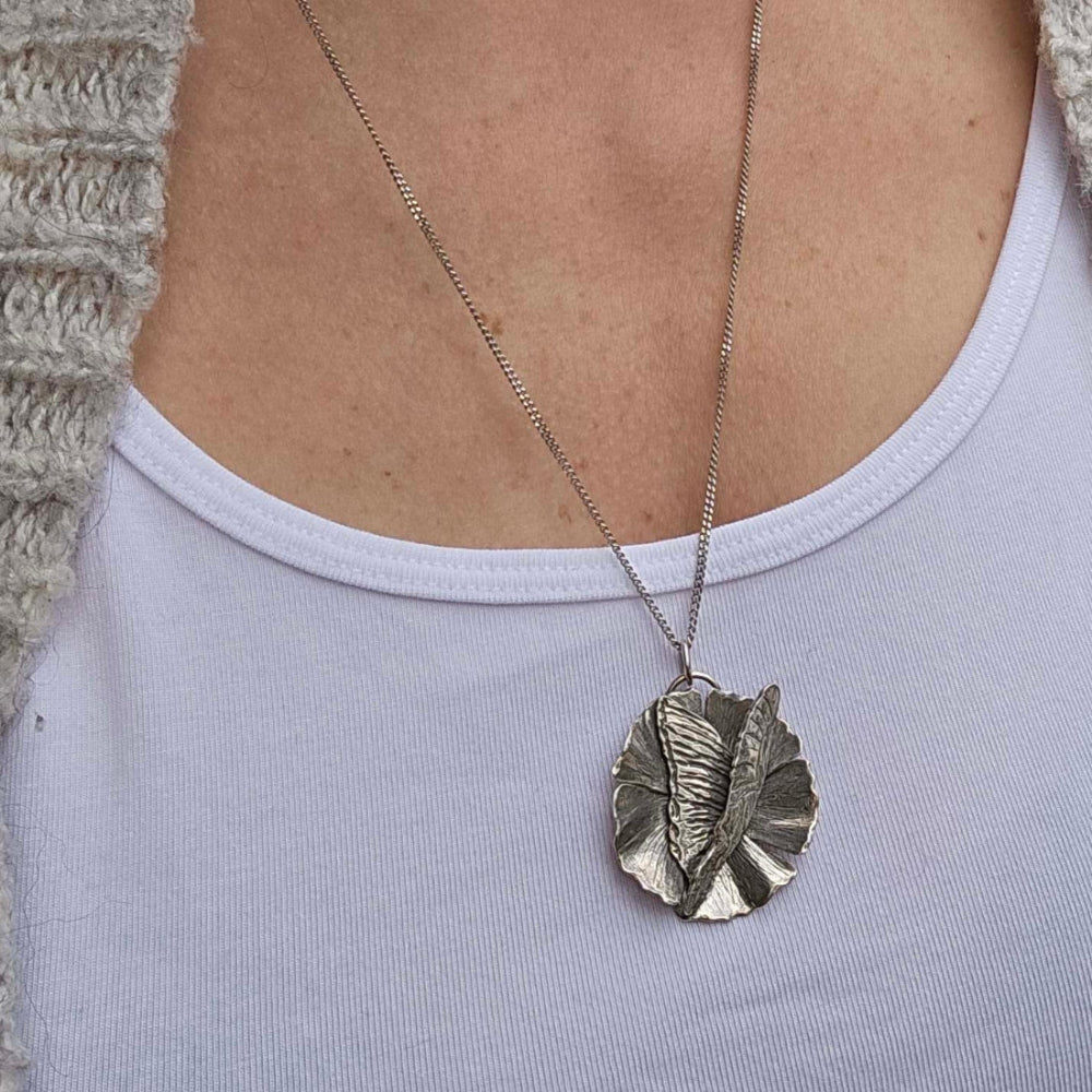 Handcrafted silver butterfly necklace with flower