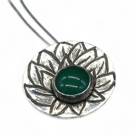 Single layer hand textured lotus flower necklace in sterling silver set with an aventurine crystal by inspirational jewelry artist Jaclyn Nicole