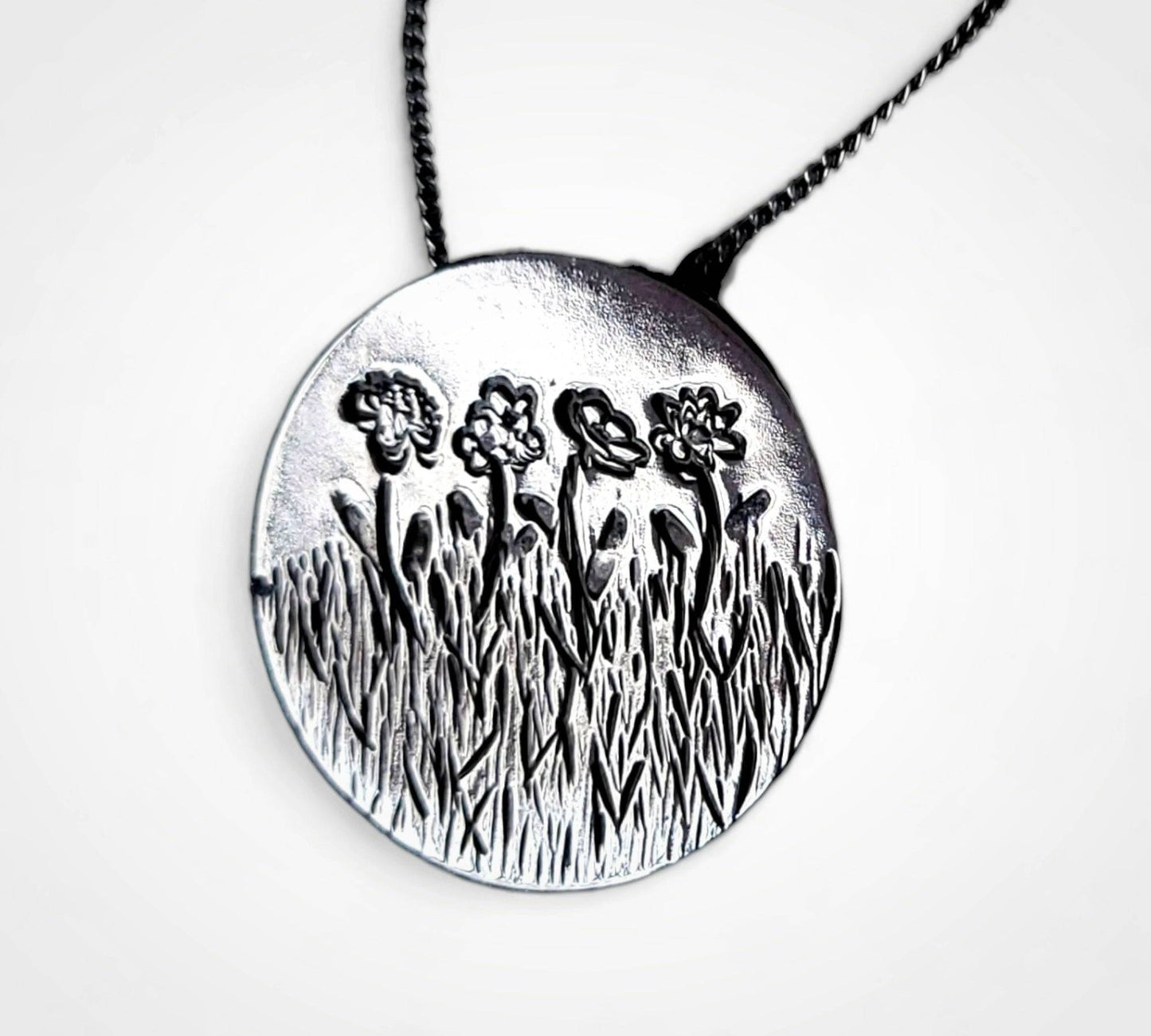 Personalized birth flower necklace in sterling silver.