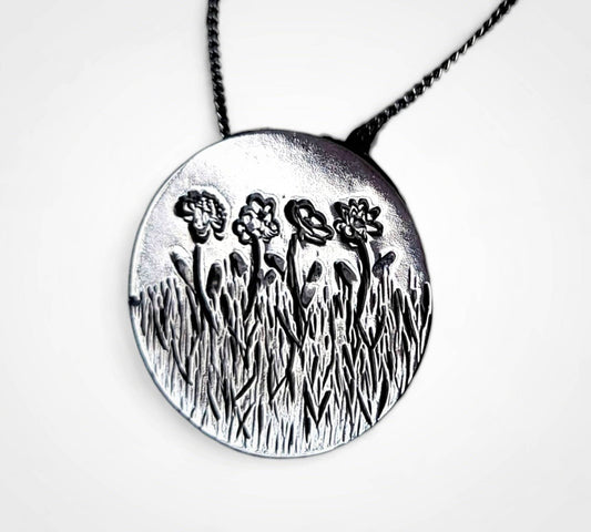 Personalized birth flower necklace in sterling silver.