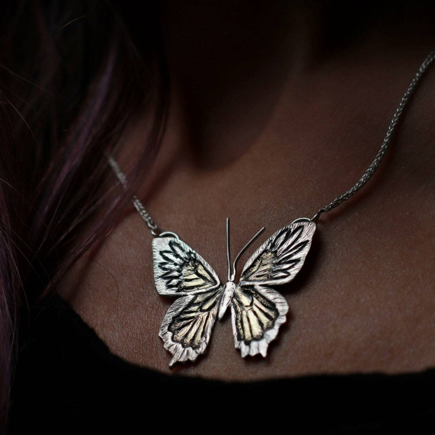 One of a Kind Butterfly Necklace for women worn around a woman's neck