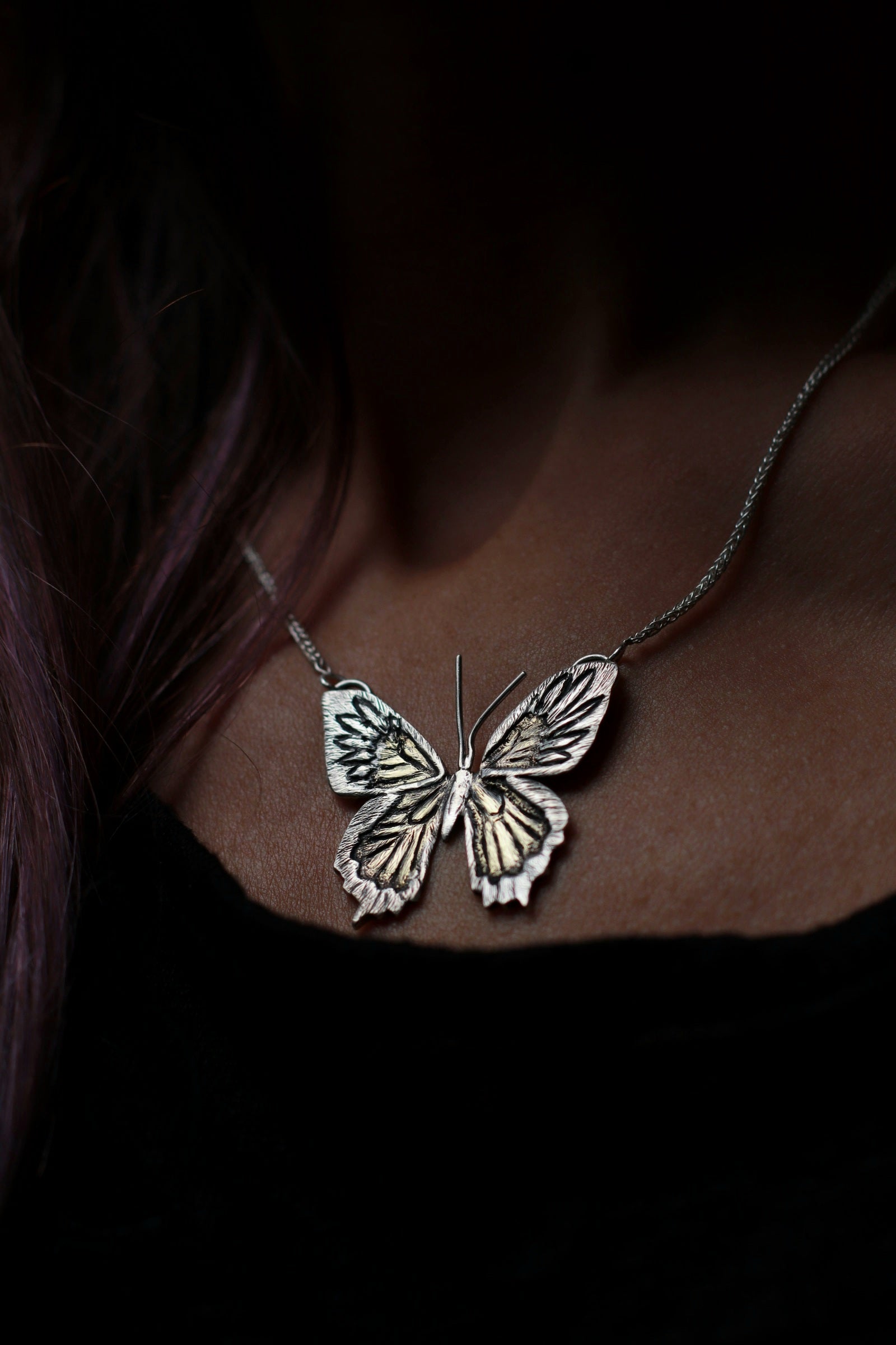 One of a Kind Butterfly Necklace for women worn around a woman's neck