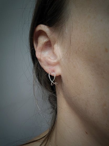 infinity earrings in sterling silver by Jaclyn Nicole, jewelry artist of inspirational jewelry.