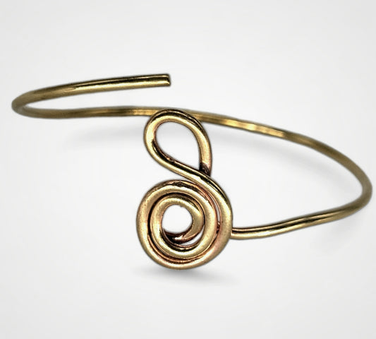 The gold gratitude symbol bracelet in solid brass, one of Jaclyn Nicole's inspirational jewelry pieces.