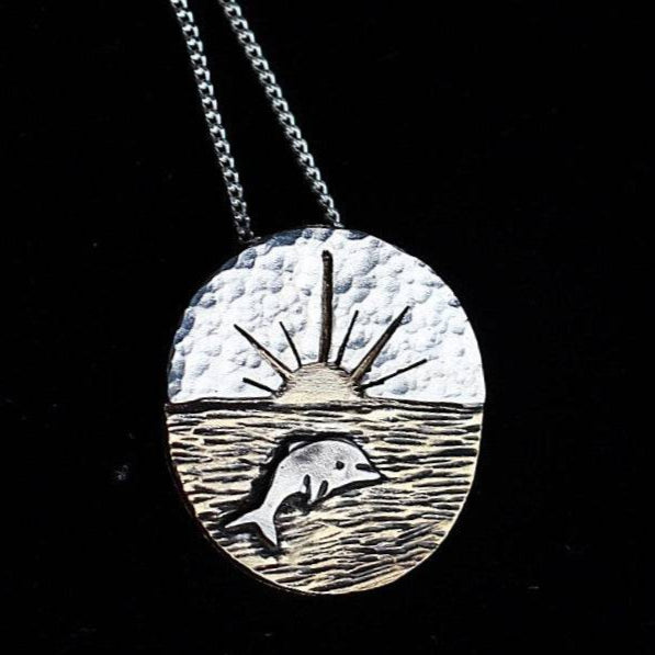 Close up of Sunset Dolphin Necklace