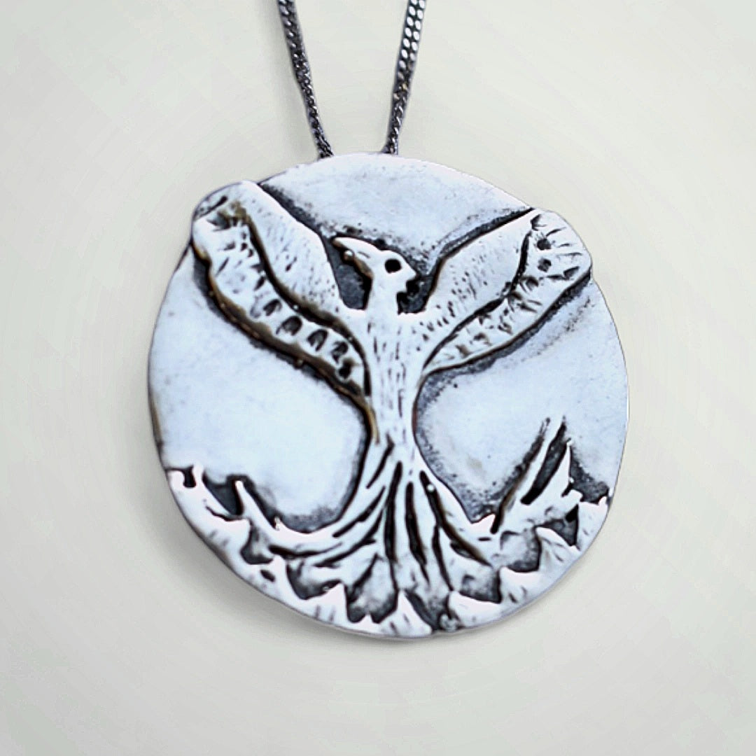 Phoenix necklace as a symbol of resilience