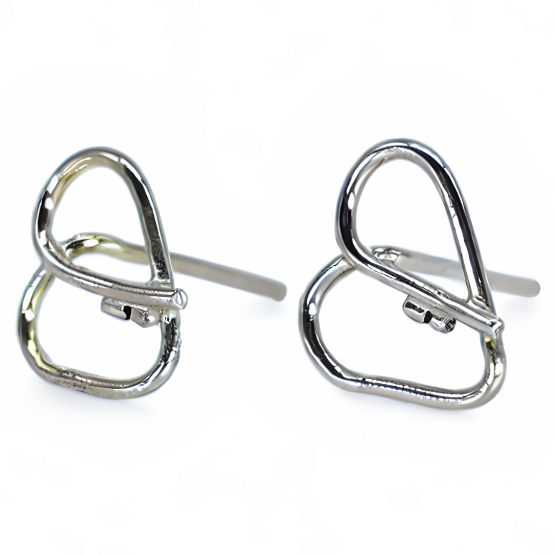 Close up of silver heart stud earrings with key feature in the center.