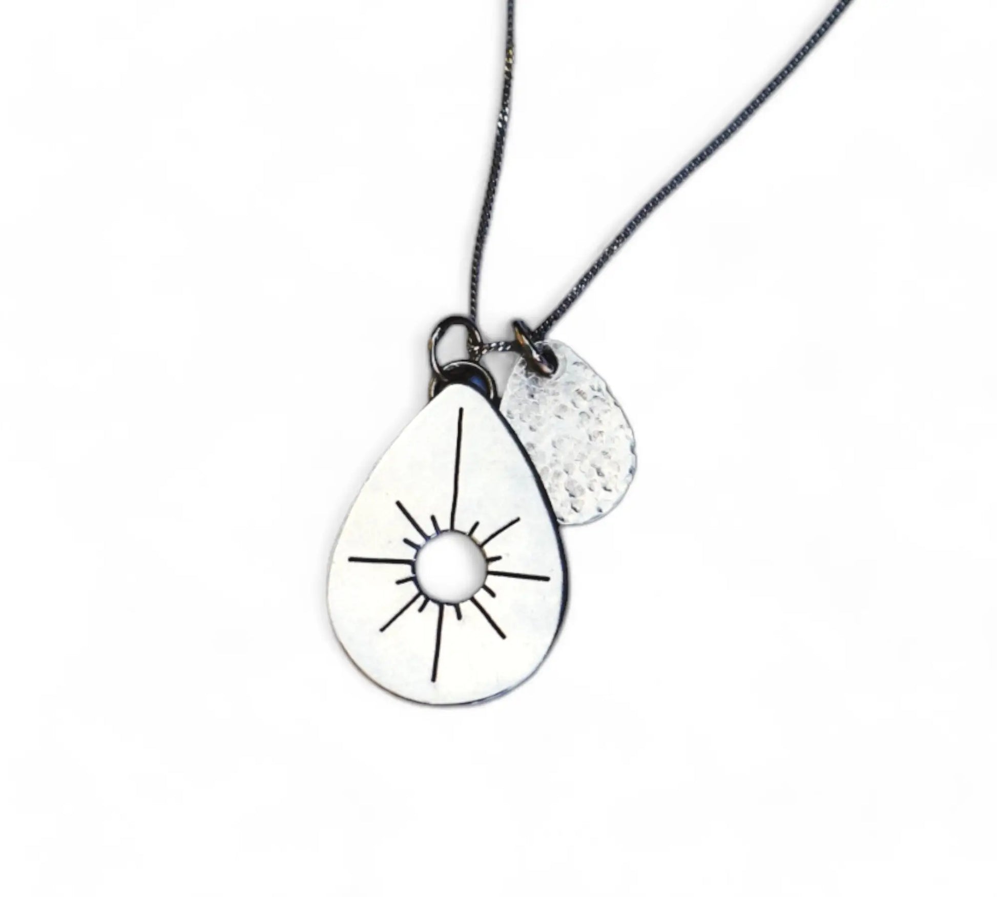 Tear drop necklace for positivity on white background