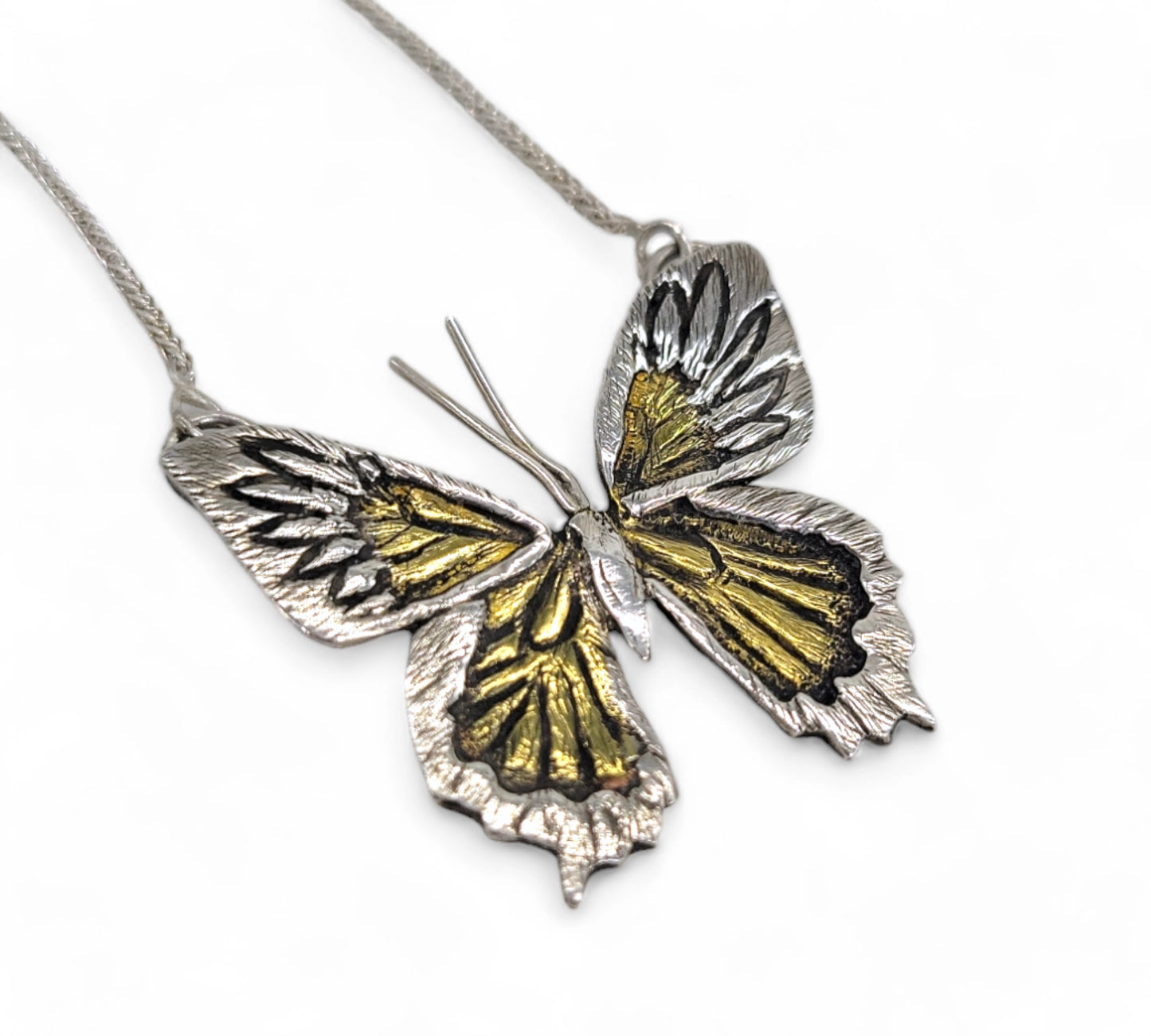 one of a kind butterfly necklace handmade by Jaclyn Nicole. Unique Pendant made in Sterling Silver and brass