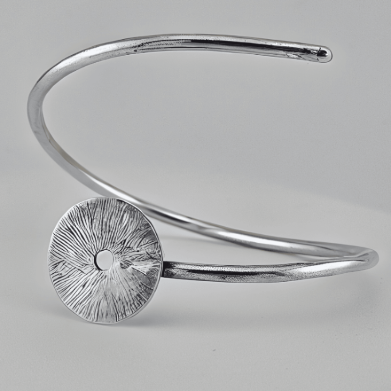 Jaclyn Nicole sterling silver manifestation bracelet on a grey background