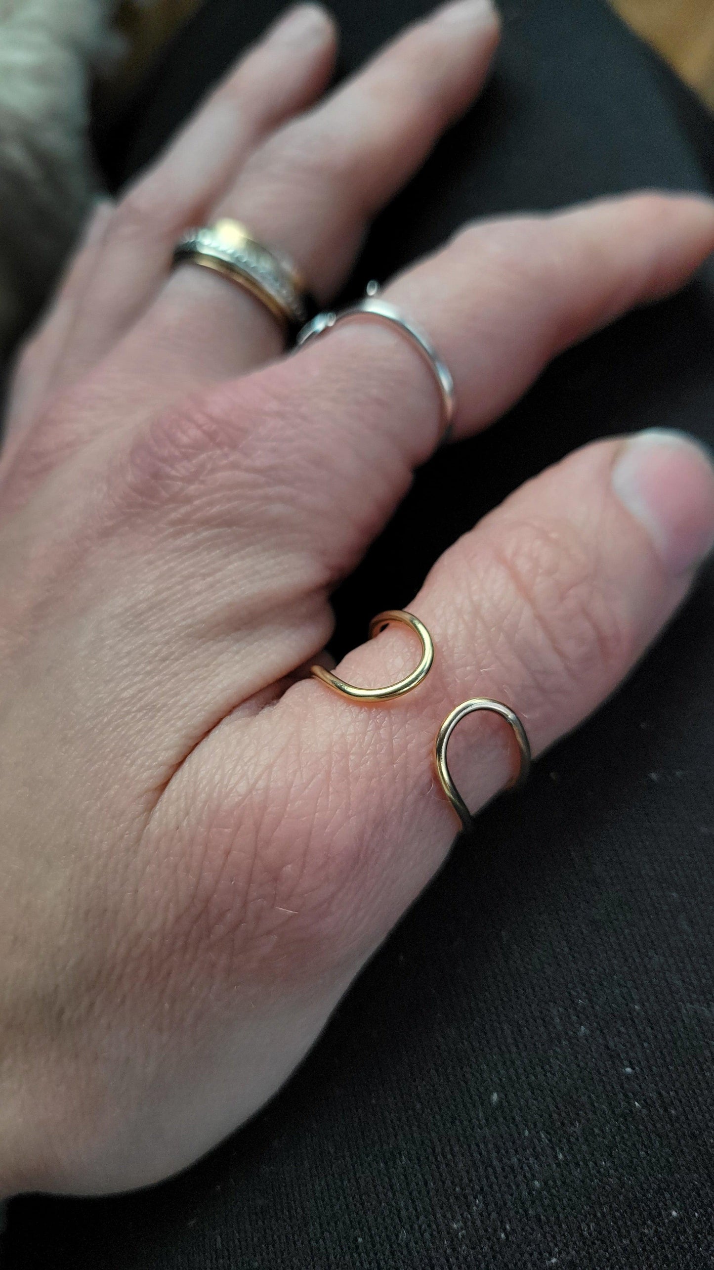 Space Between adjustable ring with meaning in 14K Gold modeled on a woman's hand