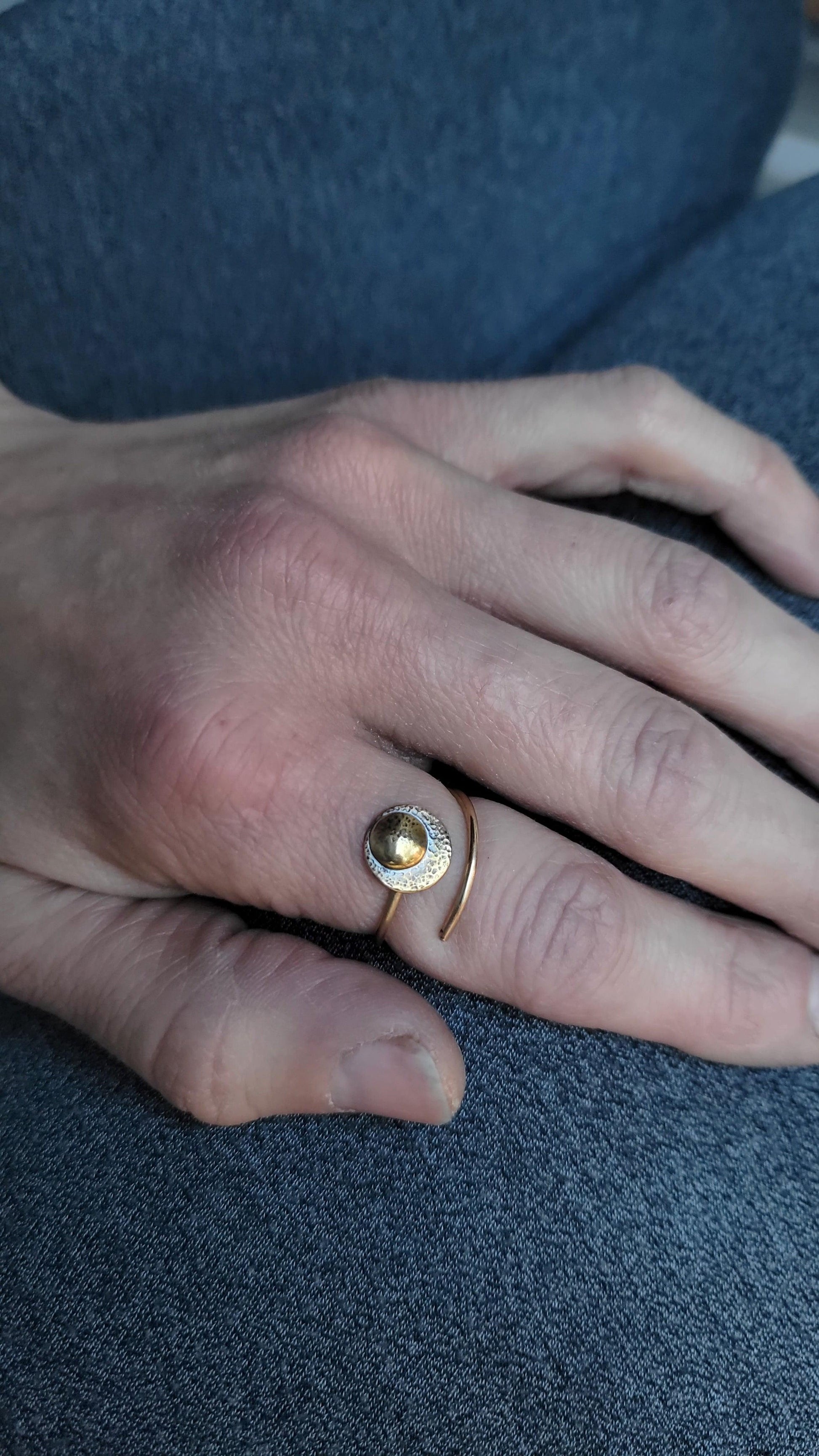 Adjustable 14K Gold Moon Ring for strength modeled on a woman's hand.