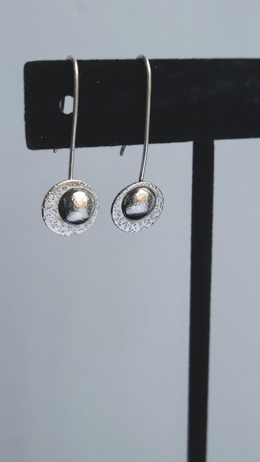 These sterling silver drop moon earrings remind you to reflect on your prior successes to overcome present challenges.