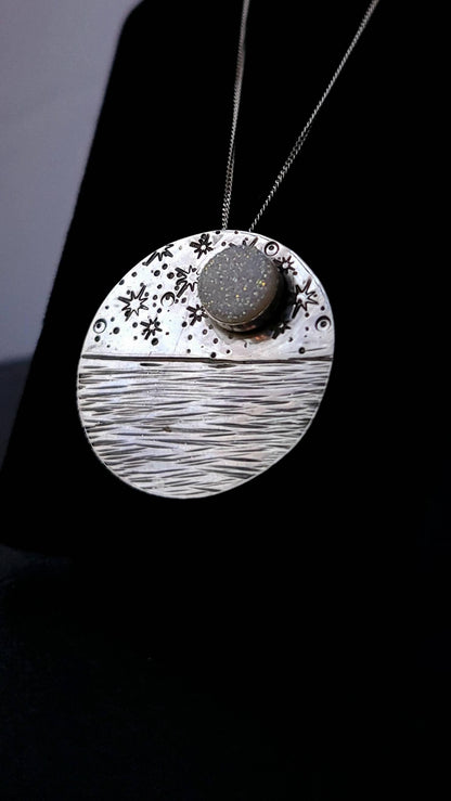 Reflections Moon Necklace - Symbols of Strength & Resilience - displayed on black velvet jewelry display.