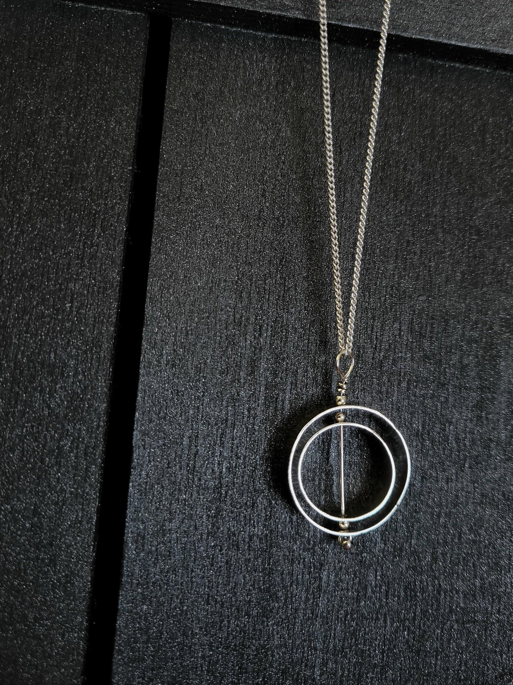 Double circle karma necklace by Jaclyn Nicole, inspirational jewelry artist.